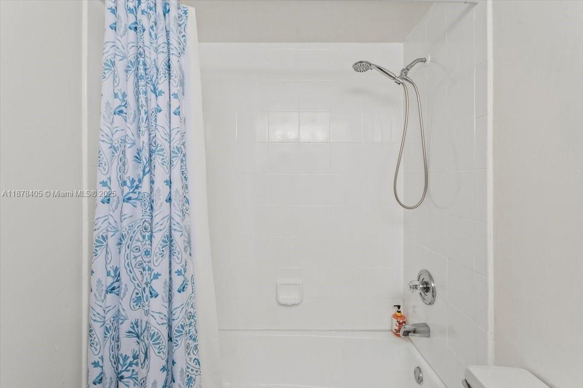 2899 Collins Avenue, Unit 1104 Miami Beach, FL 33140 - Photo 14 of 21 a bathroom with a shower and a shower