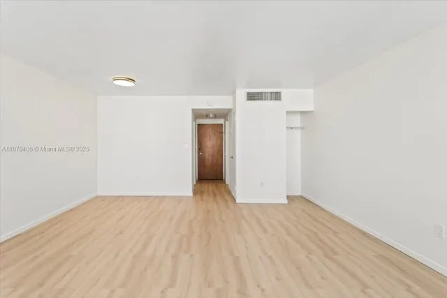 a view of balcony with wooden floor