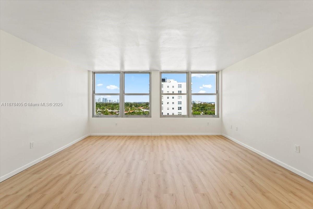 2899 Collins Avenue, Unit 1104 Miami Beach, FL 33140 - Photo 4 of 21 wooden floor in a empty room