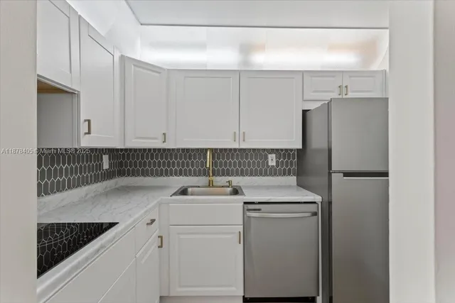 a kitchen with a sink and cabinets