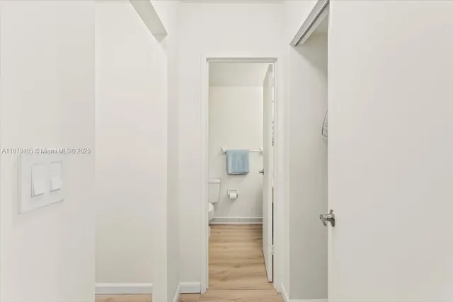 a bathroom with a sink a mirror and a toilet