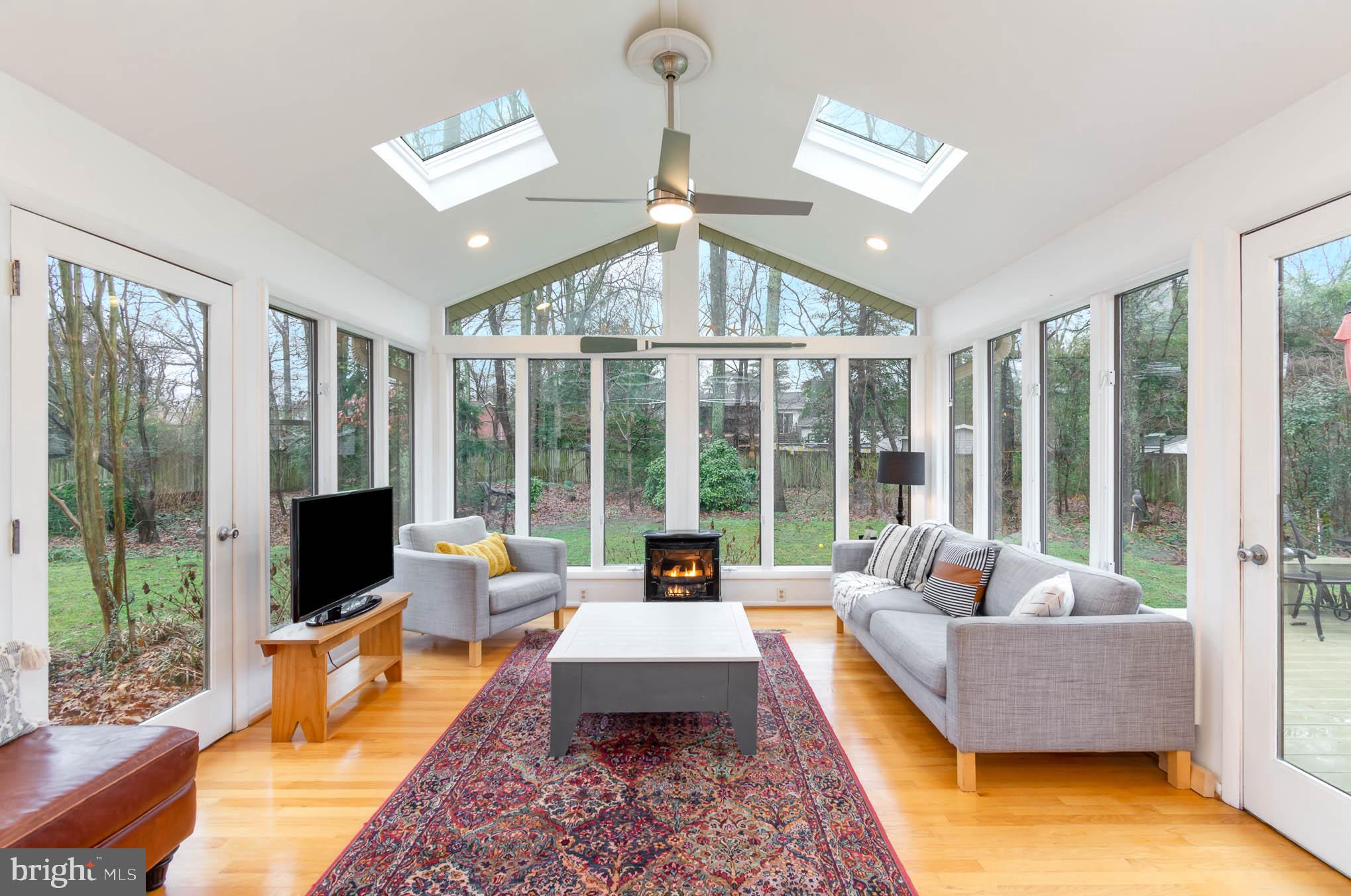 231 Falcon Drive Pasadena, MD 21122 - Photo 12 of 37 Sunroom features fireplace, lots of lights!