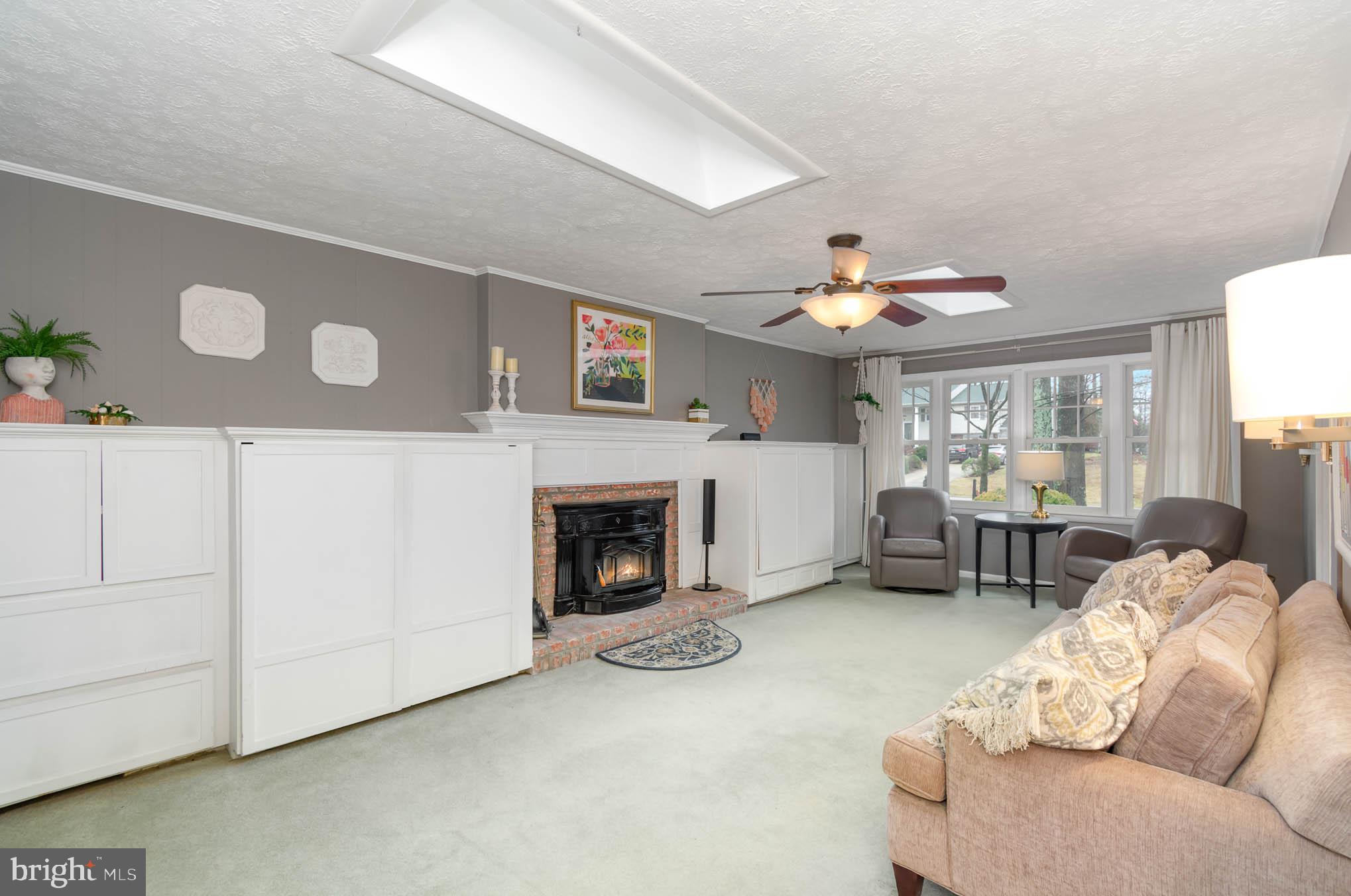 231 Falcon Drive Pasadena, MD 21122 - Photo 13 of 37 Family room with built ins, wood burning fireplace