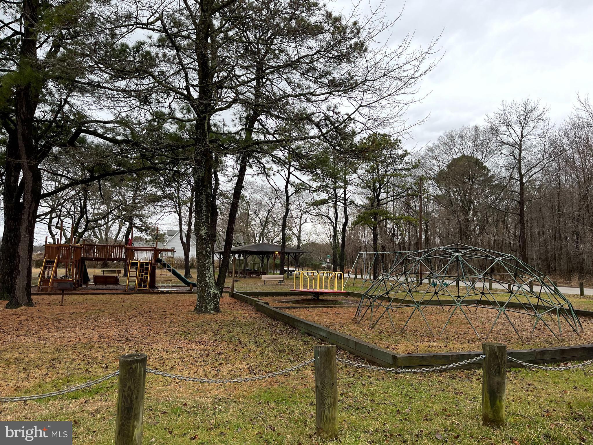 231 Falcon Drive Pasadena, MD 21122 - Photo 36 of 37 Community beach with playground, pavilion, tables