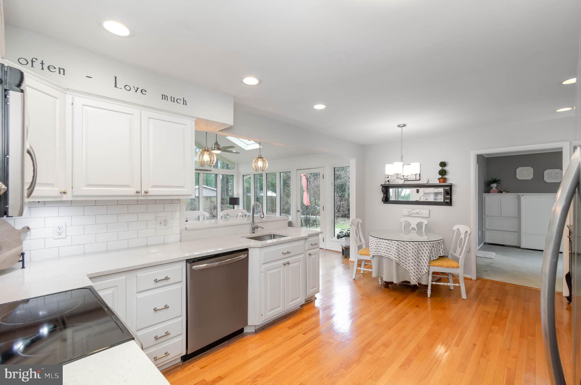 231 Falcon Drive Pasadena, MD 21122 - Photo 9 of 37 Kitchen features hardwood, stainless applicances