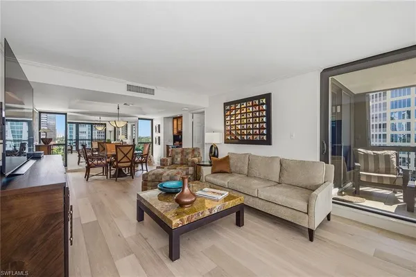 a living room with furniture and a table