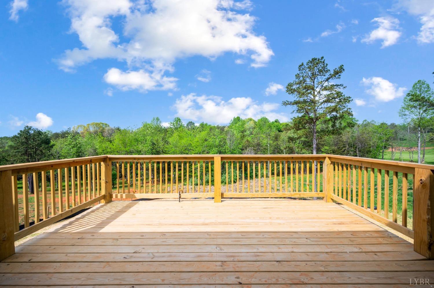 4424 Goode Road Goode, VA 24556 - Photo 12 of 71 a balcony with wooden floor and fence