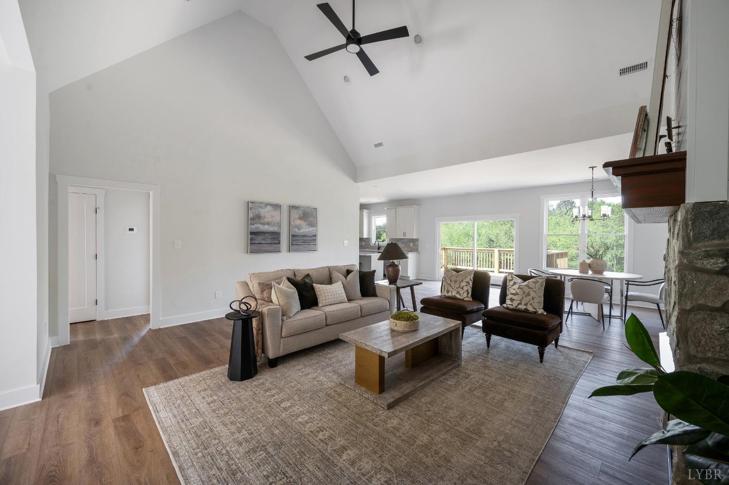 4424 Goode Road Goode, VA 24556 - Photo 14 of 71 a living room with furniture and a fireplace