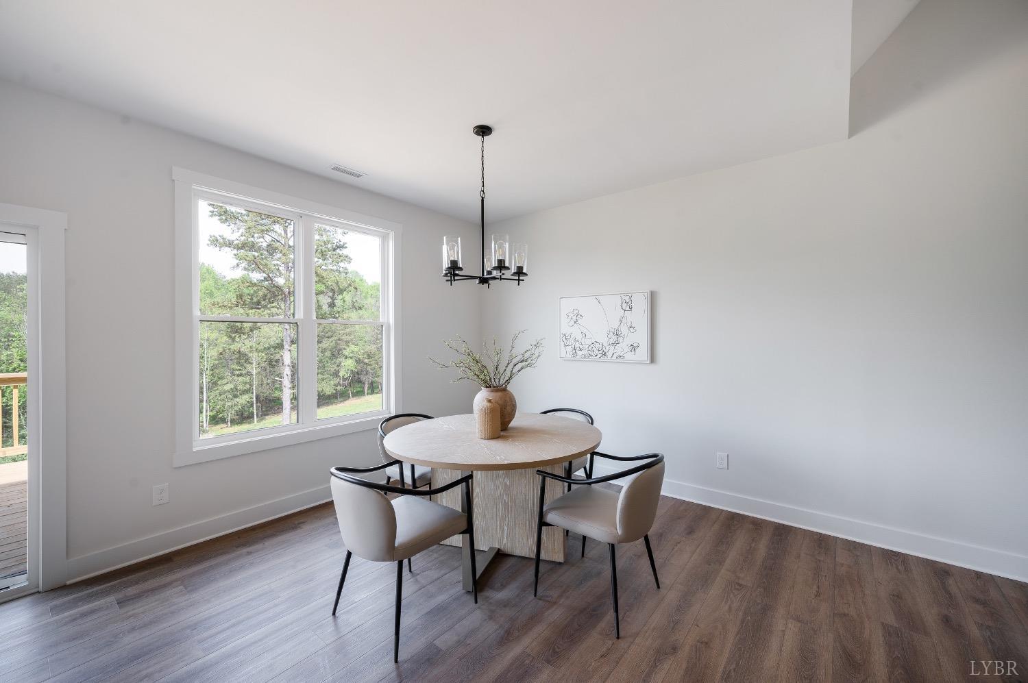 4424 Goode Road Goode, VA 24556 - Photo 15 of 71 a dining room with furniture window wooden floor