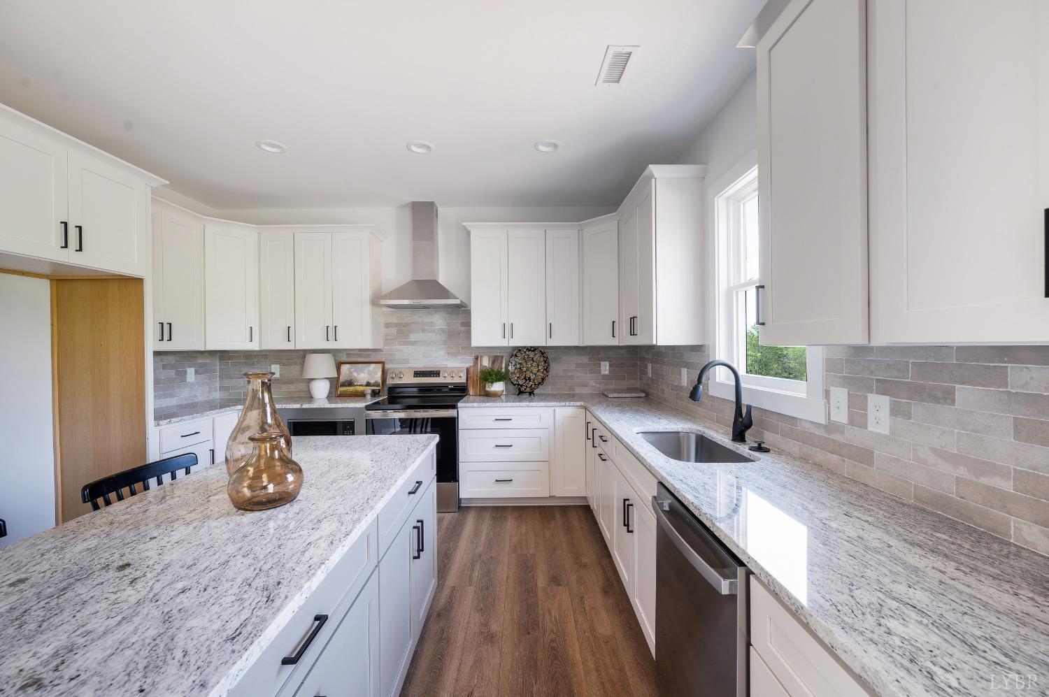 4424 Goode Road Goode, VA 24556 - Photo 19 of 71 a kitchen with sink a stove and cabinets