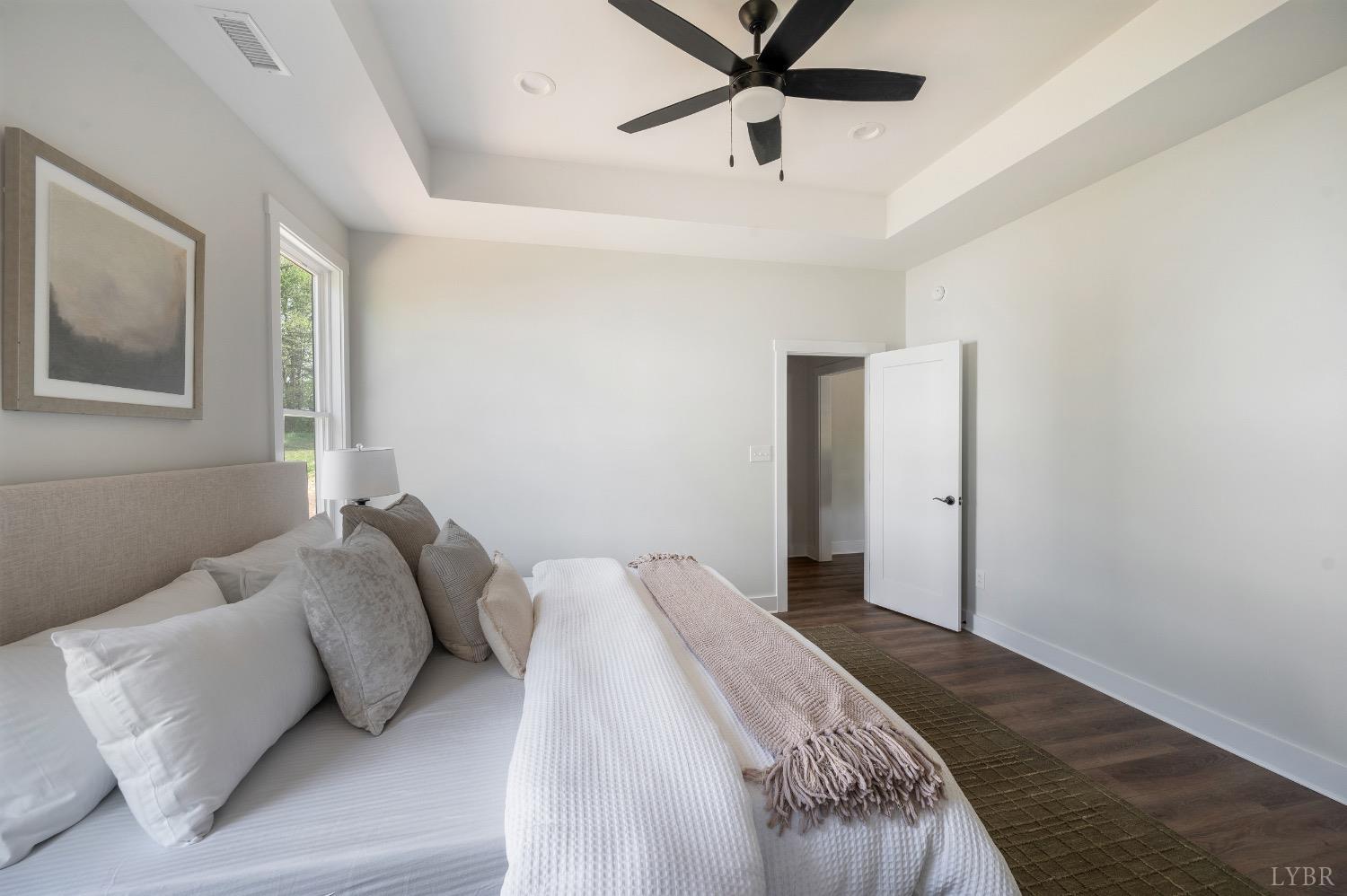 4424 Goode Road Goode, VA 24556 - Photo 32 of 71 a bedroom with a bed and a painting on the wall