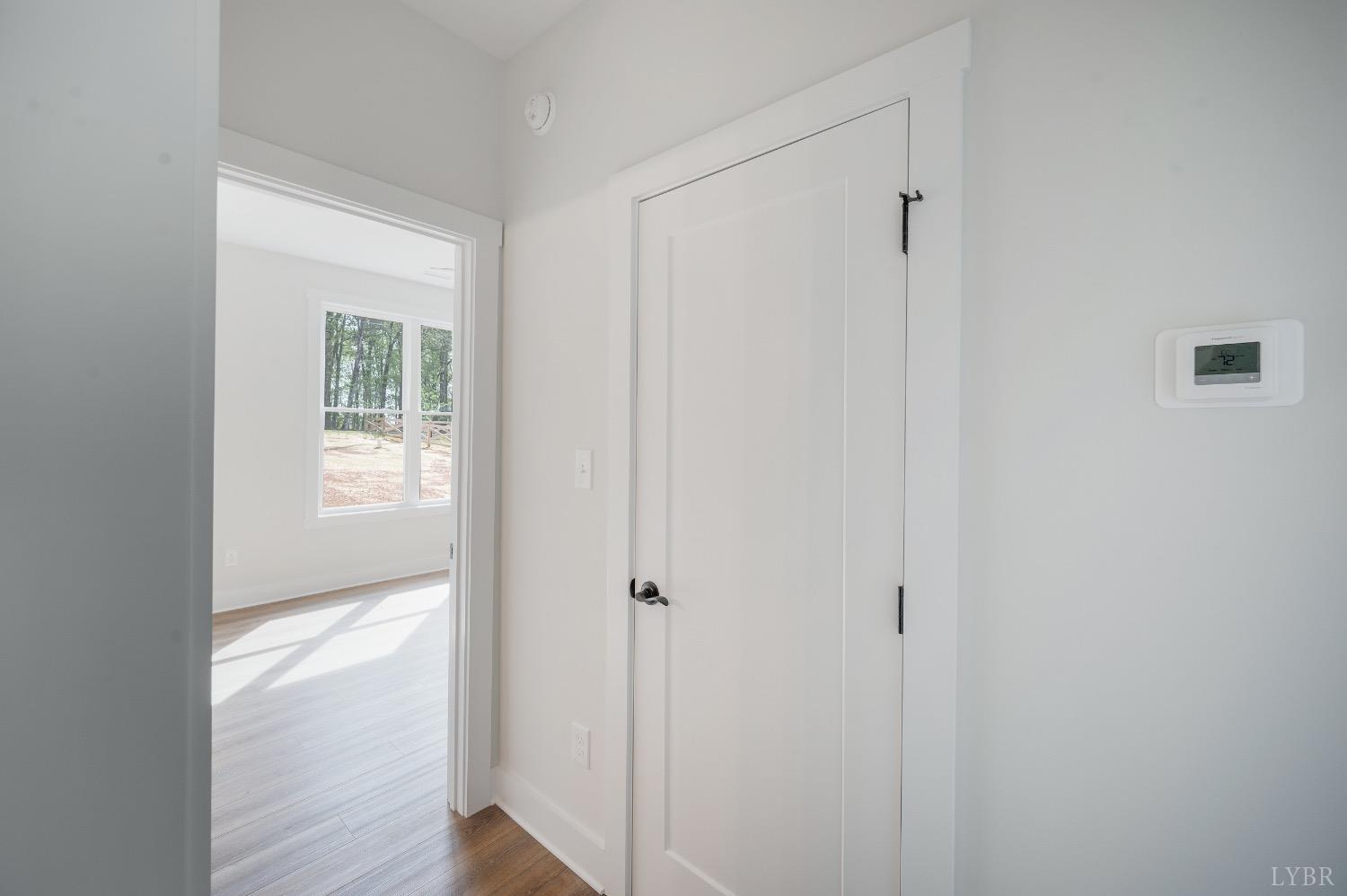 4424 Goode Road Goode, VA 24556 - Photo 44 of 71 a view of an empty room with wooden floor and a window