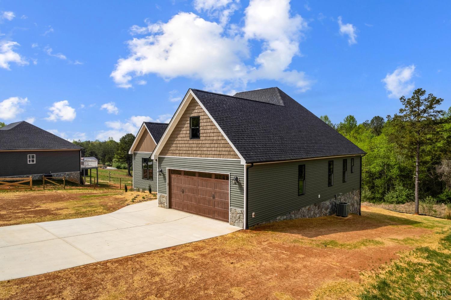 4424 Goode Road Goode, VA 24556 - Photo 66 of 71 a front view of a house with a yard and garage