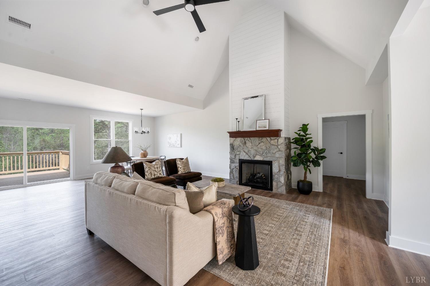 4424 Goode Road Goode, VA 24556 - Photo 7 of 71 a living room with furniture and a fireplace