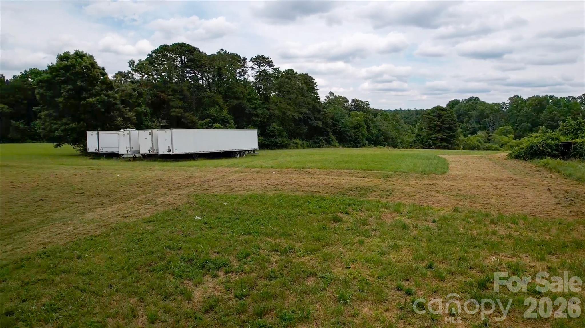 412 McMurray Road Flat Rock, NC 28731 - Photo 13 of 14 a backyard of a house with lots of green space