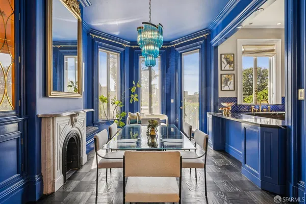 a kitchen with stainless steel appliances a stove a sink and a microwave