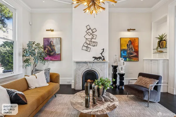 a view of a livingroom with furniture and a potted plant