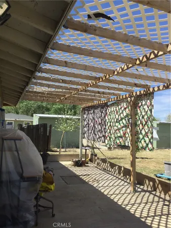 a view of a chairs and tables in the back yard
