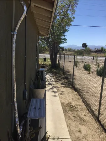 a view of a backyard of the house