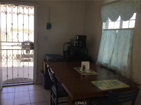 a dining room with table and chairs
