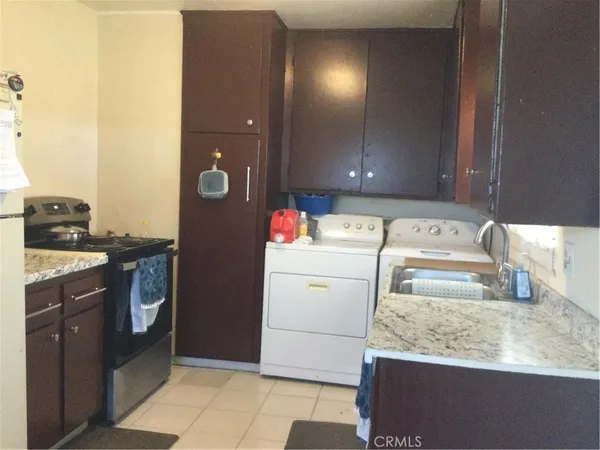 a utility room with washer and dryer