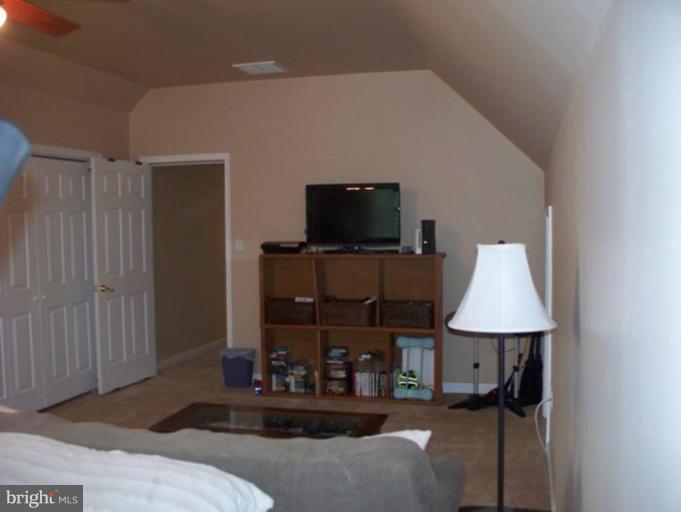 3185 Jones Road Dunkirk, MD 20754 - Photo 10 of 28 a living room with furniture and a flat screen tv