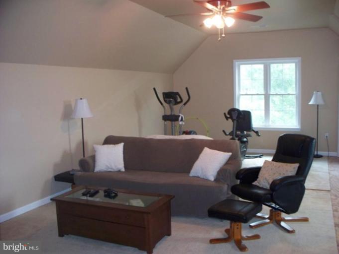 3185 Jones Road Dunkirk, MD 20754 - Photo 16 of 28 a living room with furniture and a lamp