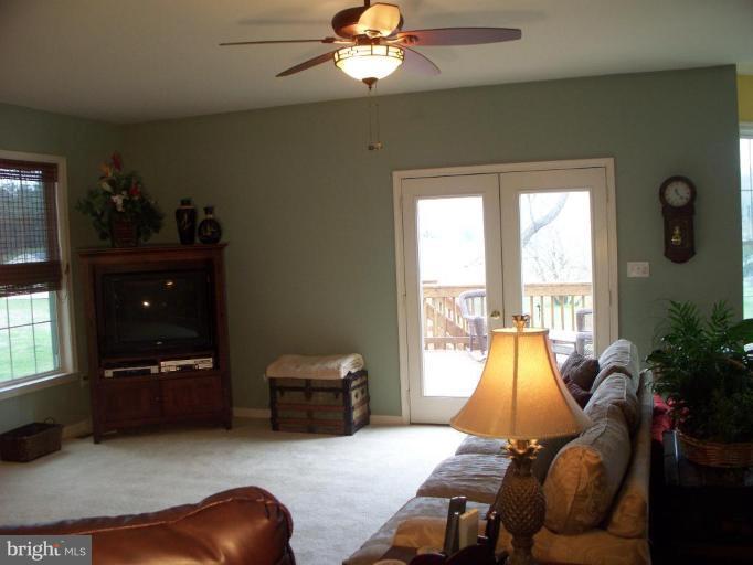 3185 Jones Road Dunkirk, MD 20754 - Photo 23 of 28 a living room with furniture and a flat screen tv