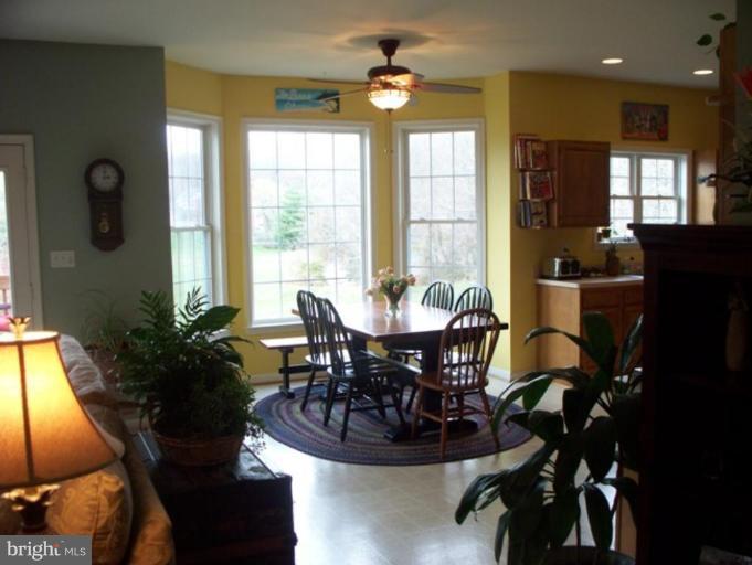 3185 Jones Road Dunkirk, MD 20754 - Photo 4 of 28 a view of a dining room with furniture and chandelier