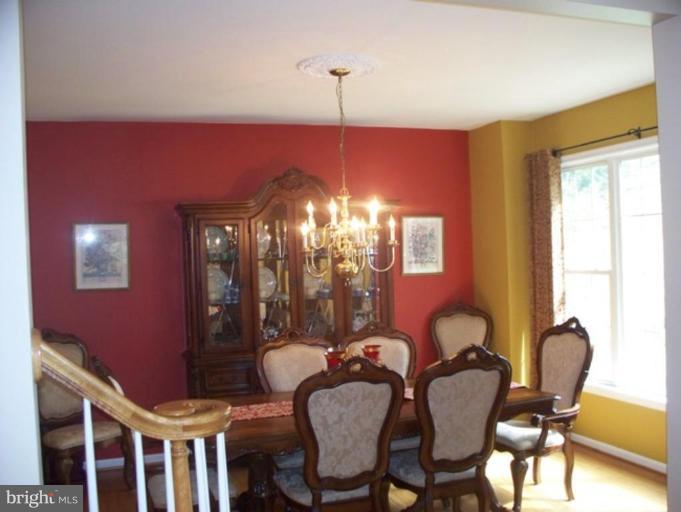 3185 Jones Road Dunkirk, MD 20754 - Photo 6 of 28 a view of a dining room with furniture and chandelier