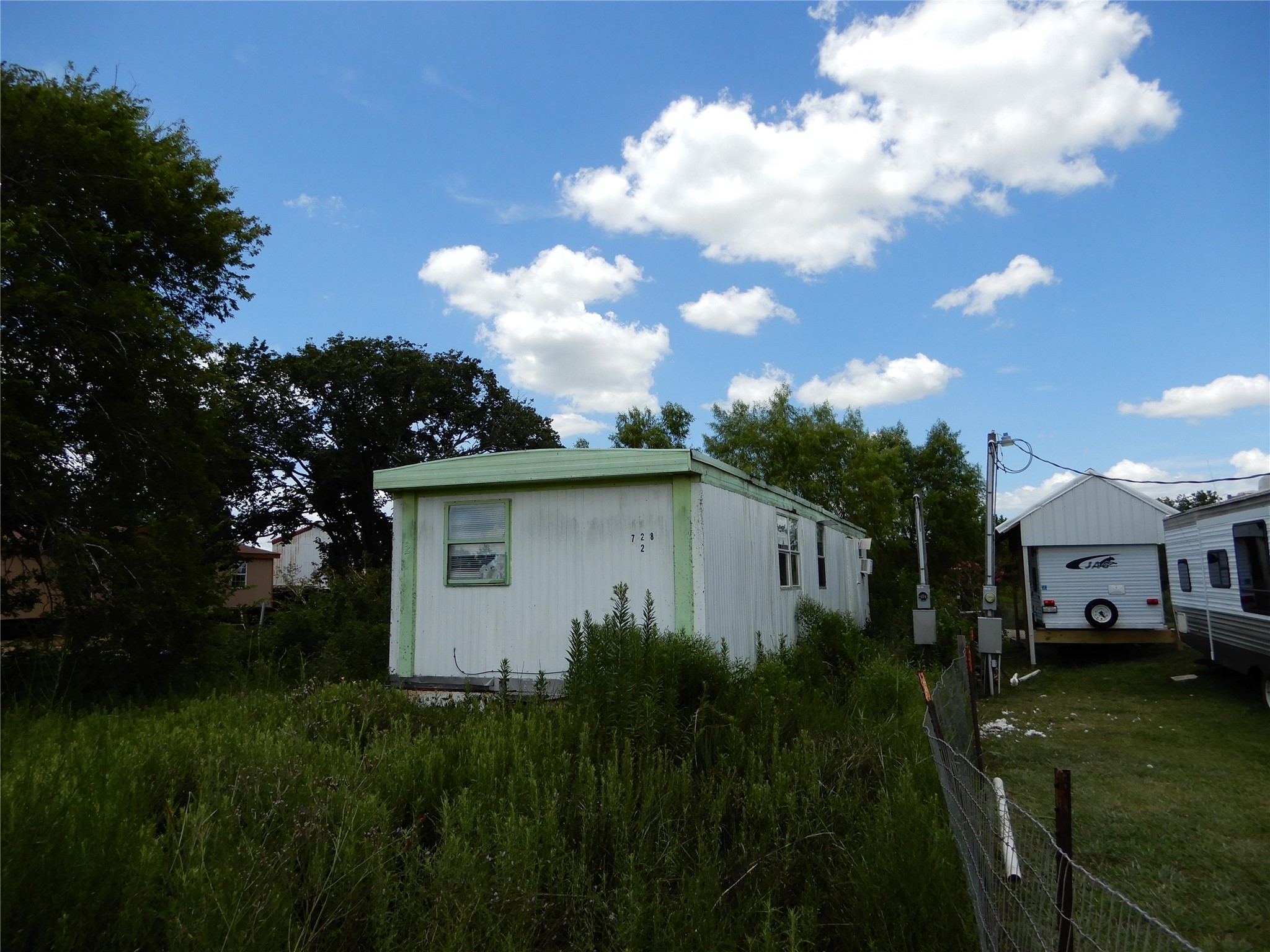 563 Fairway Drive Angleton, TX 77515 - Photo 3 of 6 a view of a house with backyard and garden