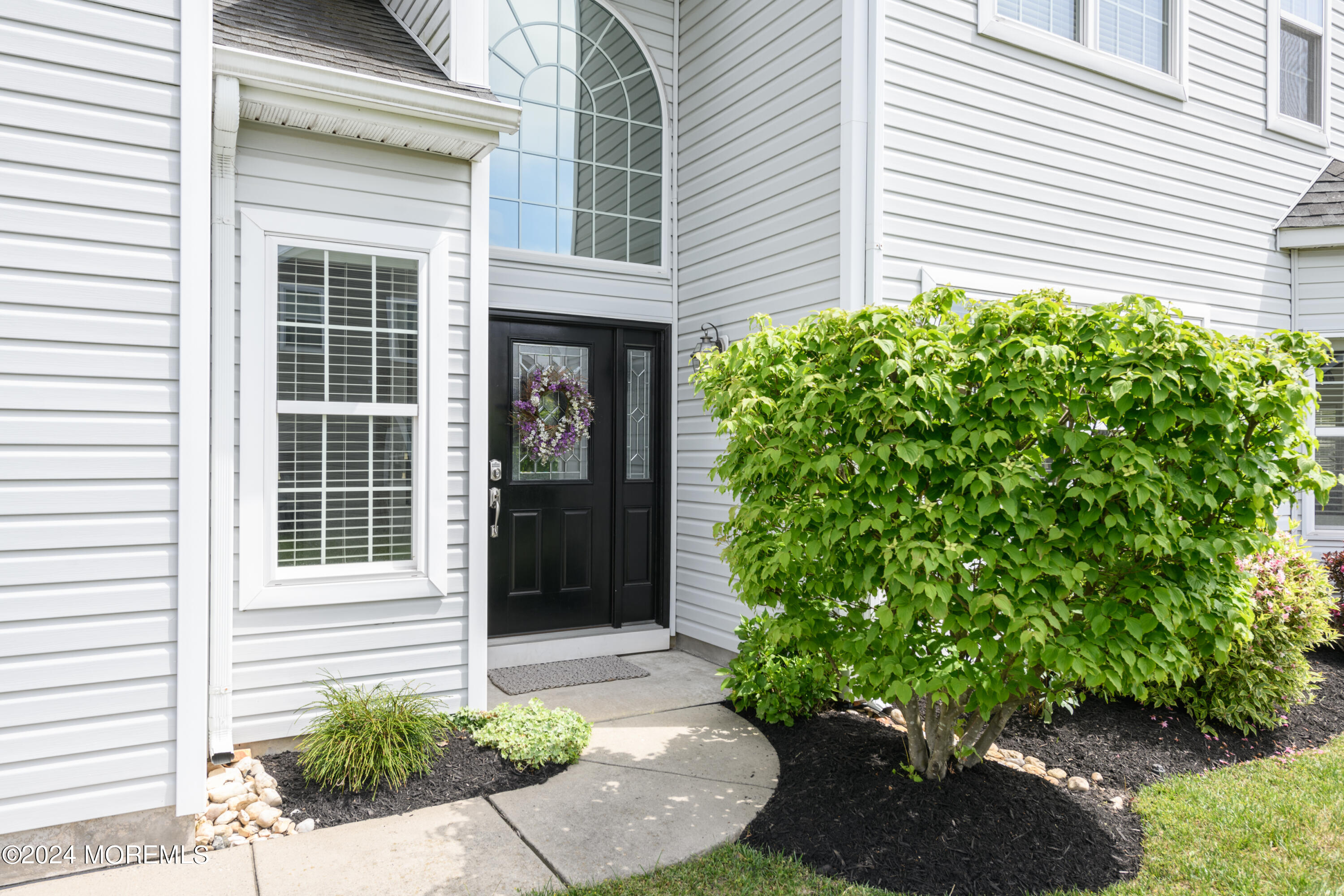 23 Sea Bright Way Waretown, NJ 08758 - Photo 13 of 59 a house with a potted plant in front of door