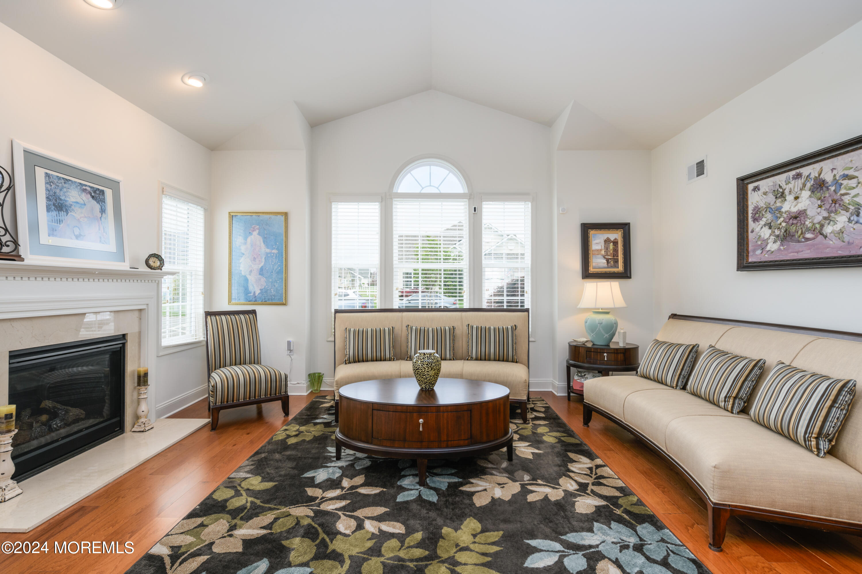 23 Sea Bright Way Waretown, NJ 08758 - Photo 16 of 59 a living room with furniture a fireplace and a table