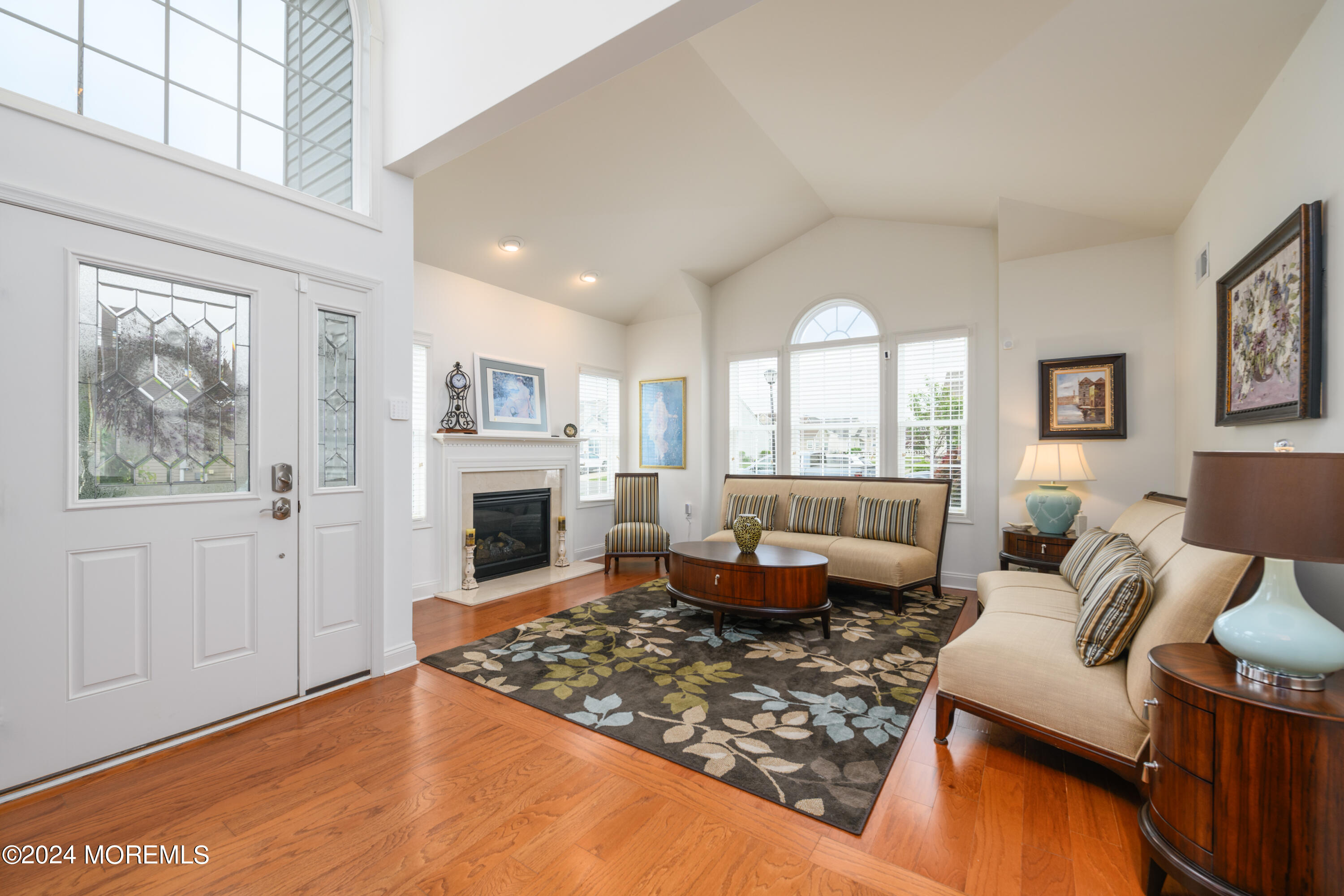 23 Sea Bright Way Waretown, NJ 08758 - Photo 17 of 59 a living room with furniture large window and a fireplace