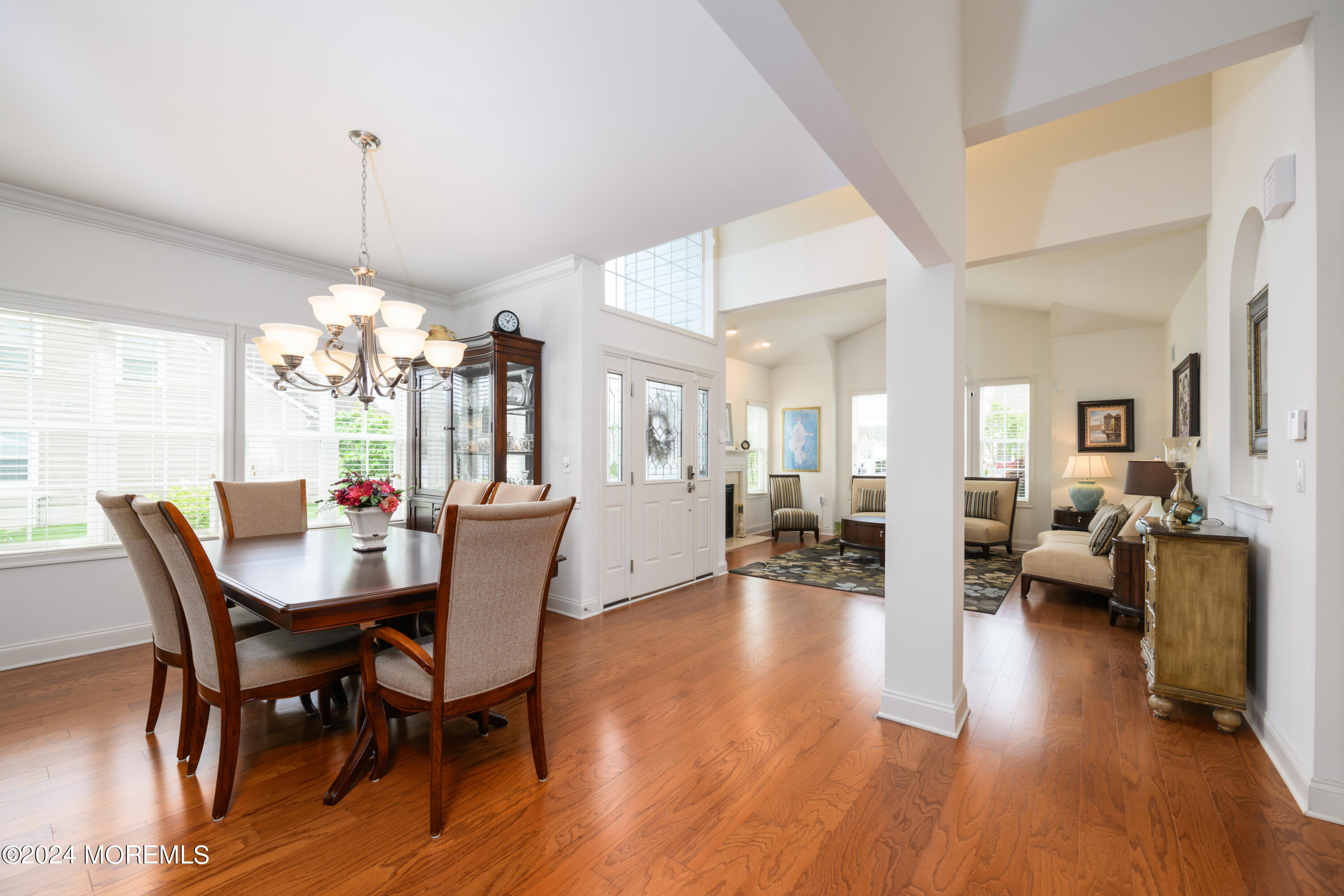 23 Sea Bright Way Waretown, NJ 08758 - Photo 20 of 59 a view of a dining room with furniture wooden floor and a chandelier
