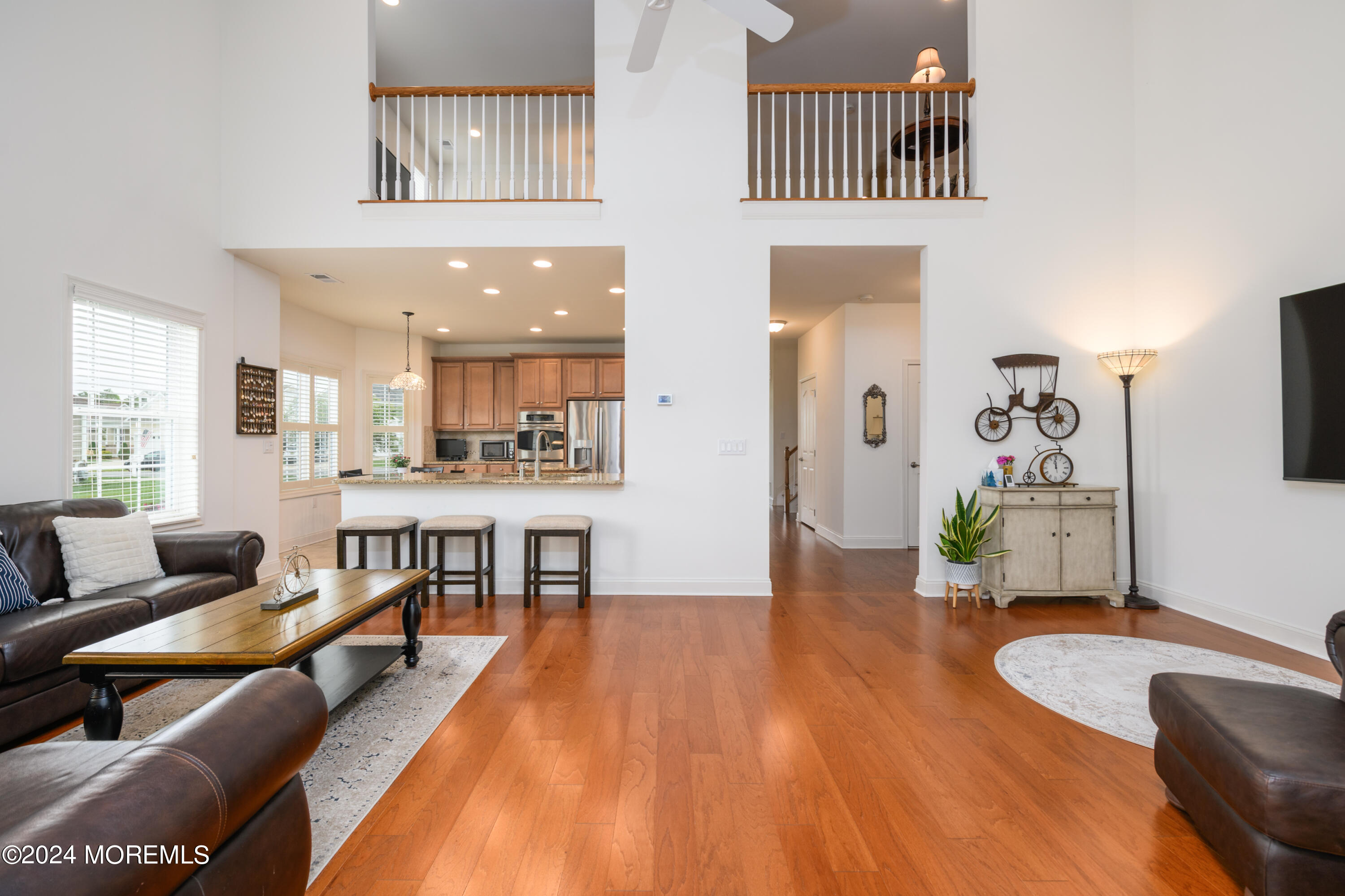 23 Sea Bright Way Waretown, NJ 08758 - Photo 28 of 59 a living room with furniture and a wooden floor