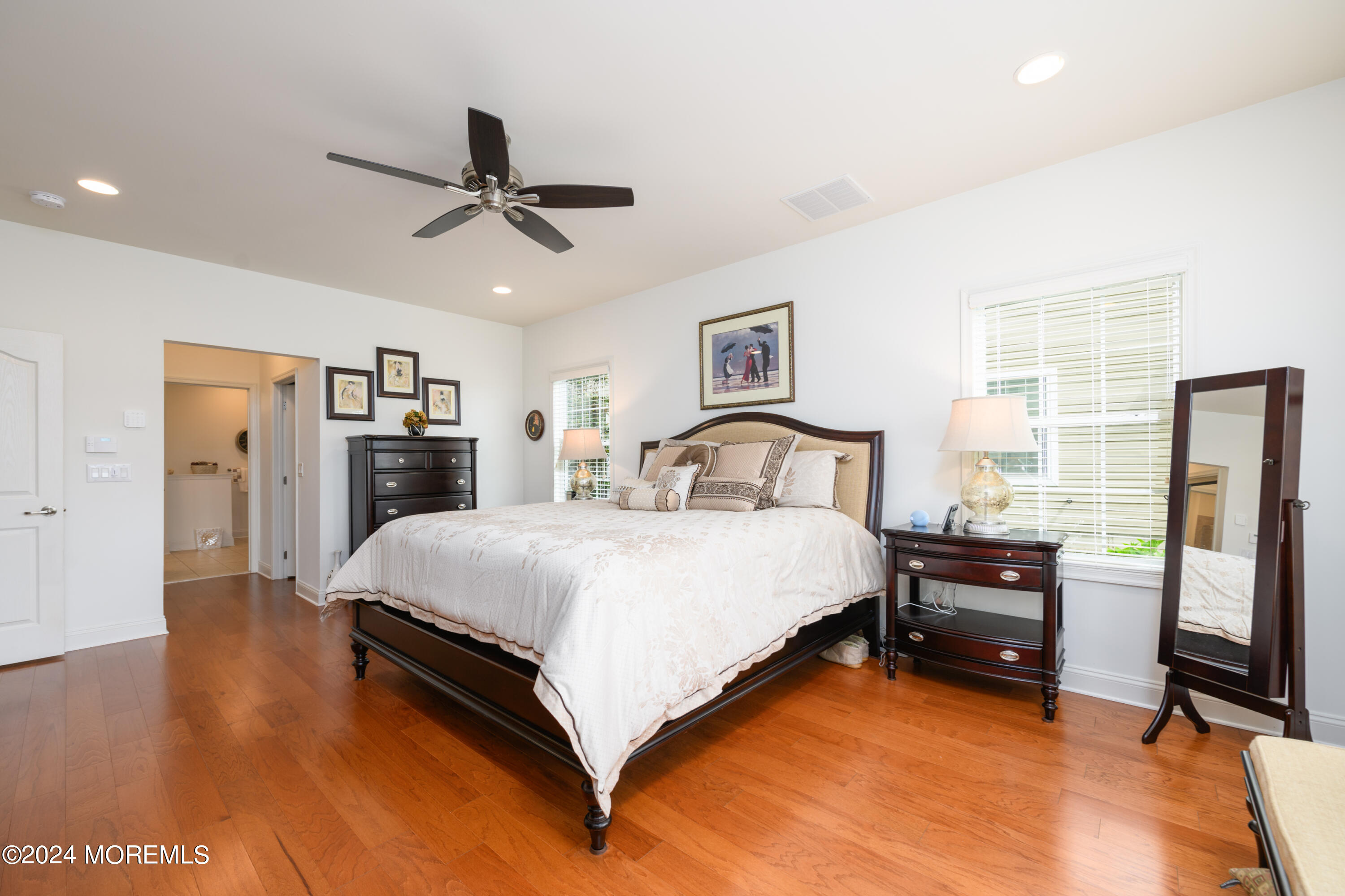 23 Sea Bright Way Waretown, NJ 08758 - Photo 33 of 59 a bedroom with a bed and wooden floor