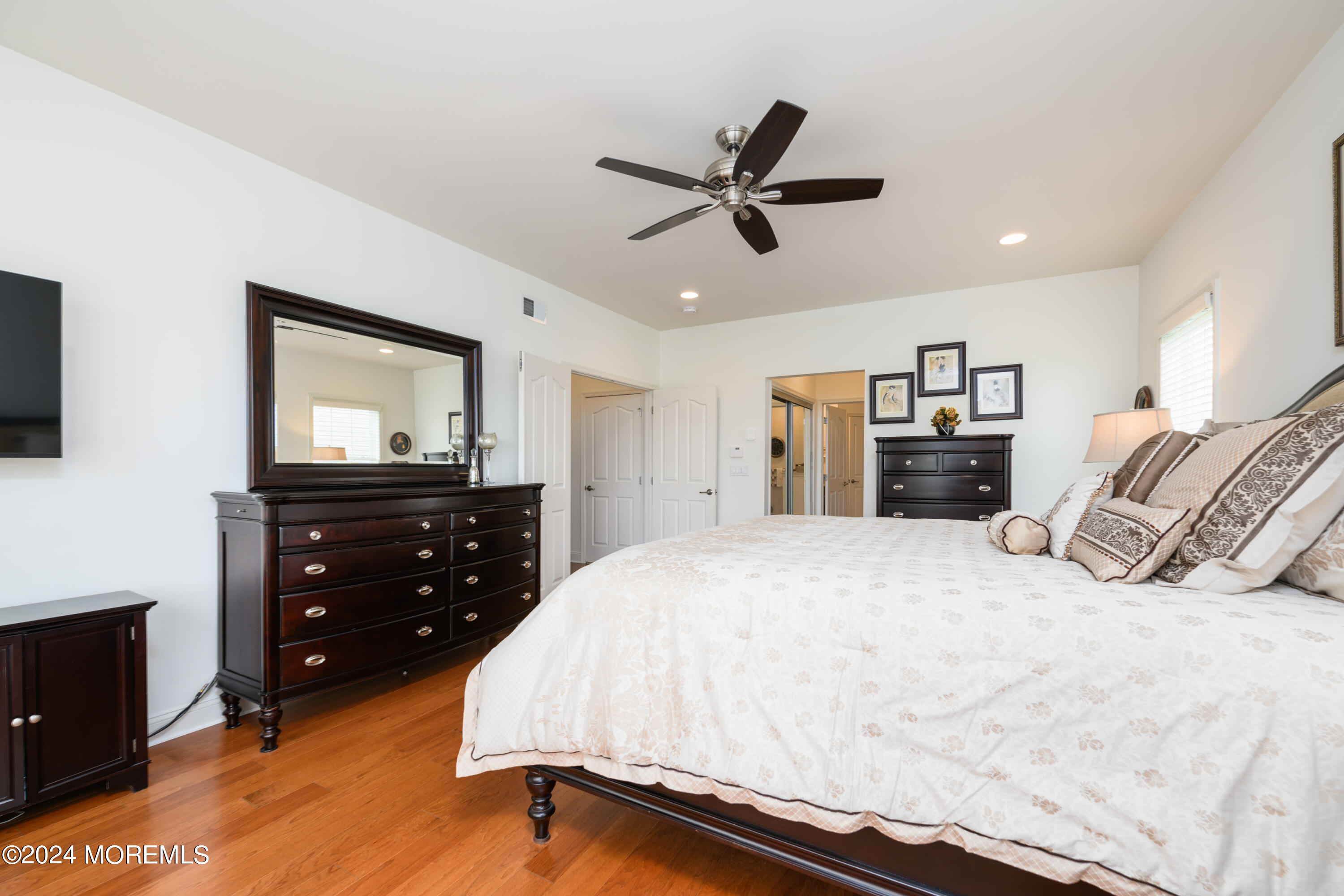 23 Sea Bright Way Waretown, NJ 08758 - Photo 34 of 59 a bedroom with a bed and a flat screen tv