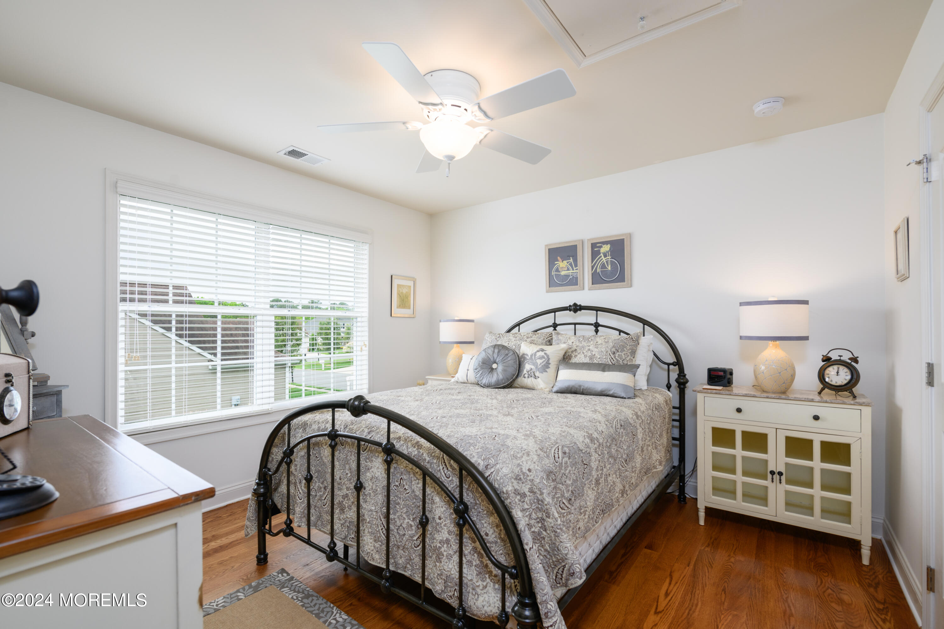 23 Sea Bright Way Waretown, NJ 08758 - Photo 37 of 59 a bedroom with a bed a dresser with wooden floor