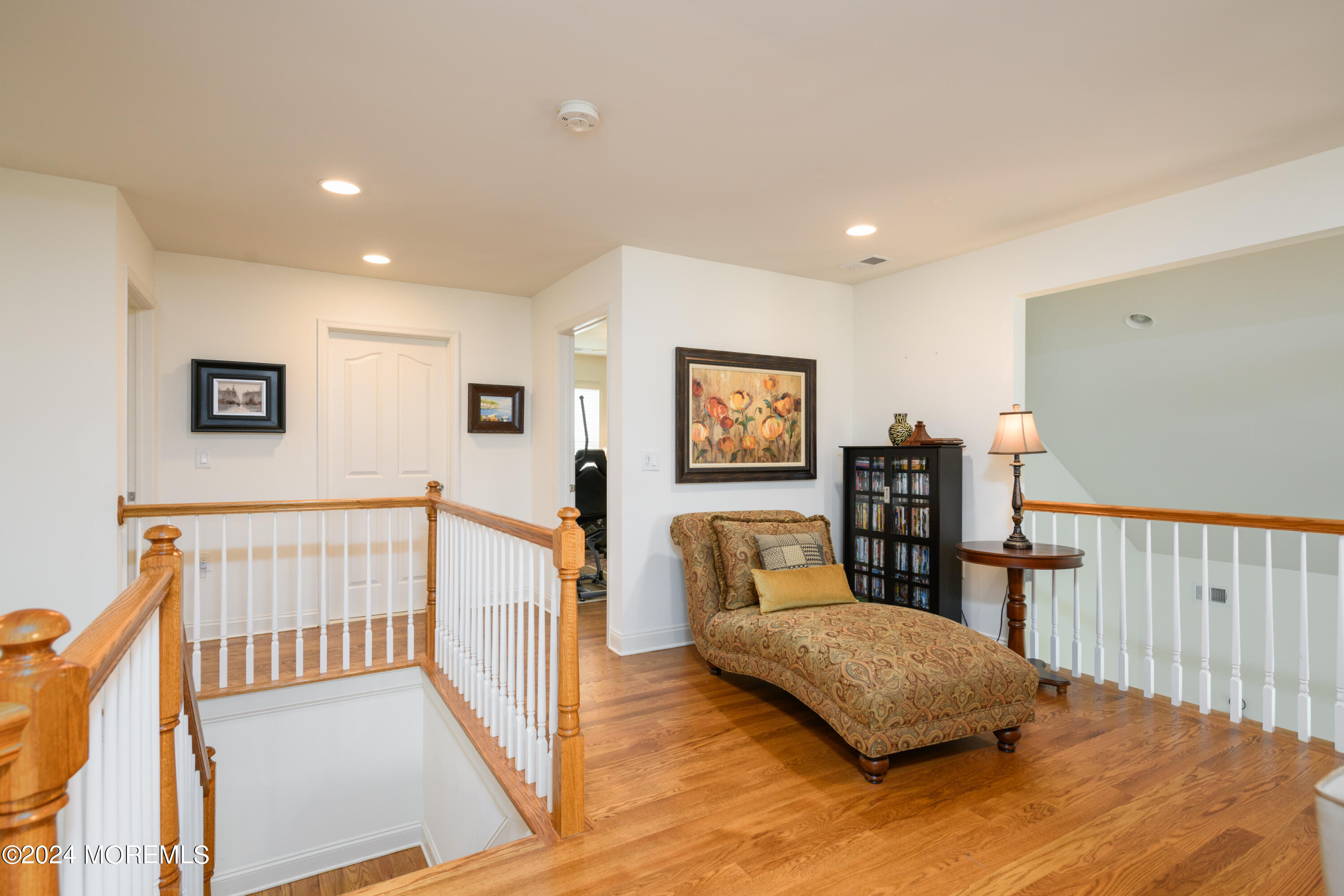 23 Sea Bright Way Waretown, NJ 08758 - Photo 40 of 59 a living room with furniture and a wooden floor