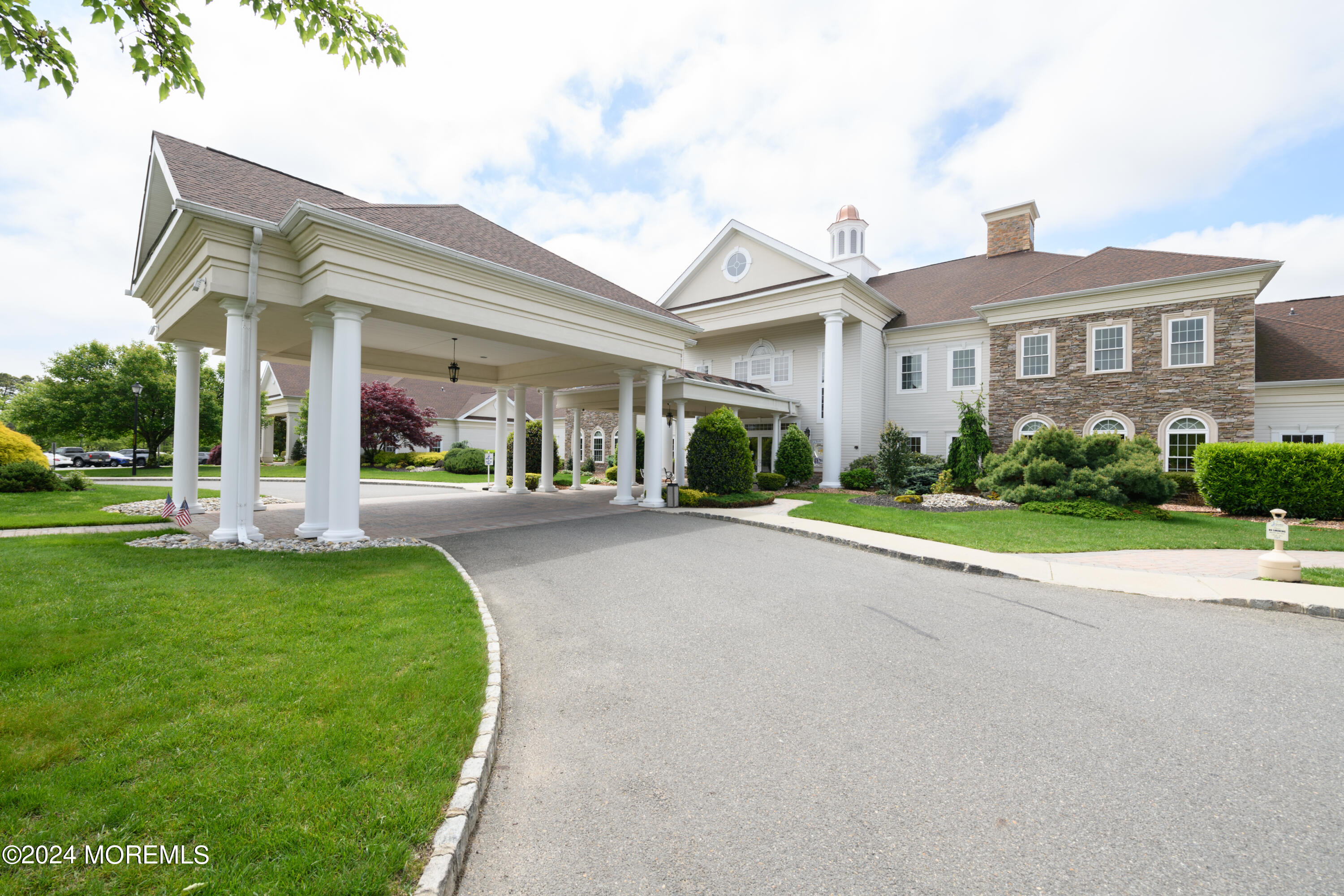 23 Sea Bright Way Waretown, NJ 08758 - Photo 51 of 59 a front view of a house with a yard and potted plants