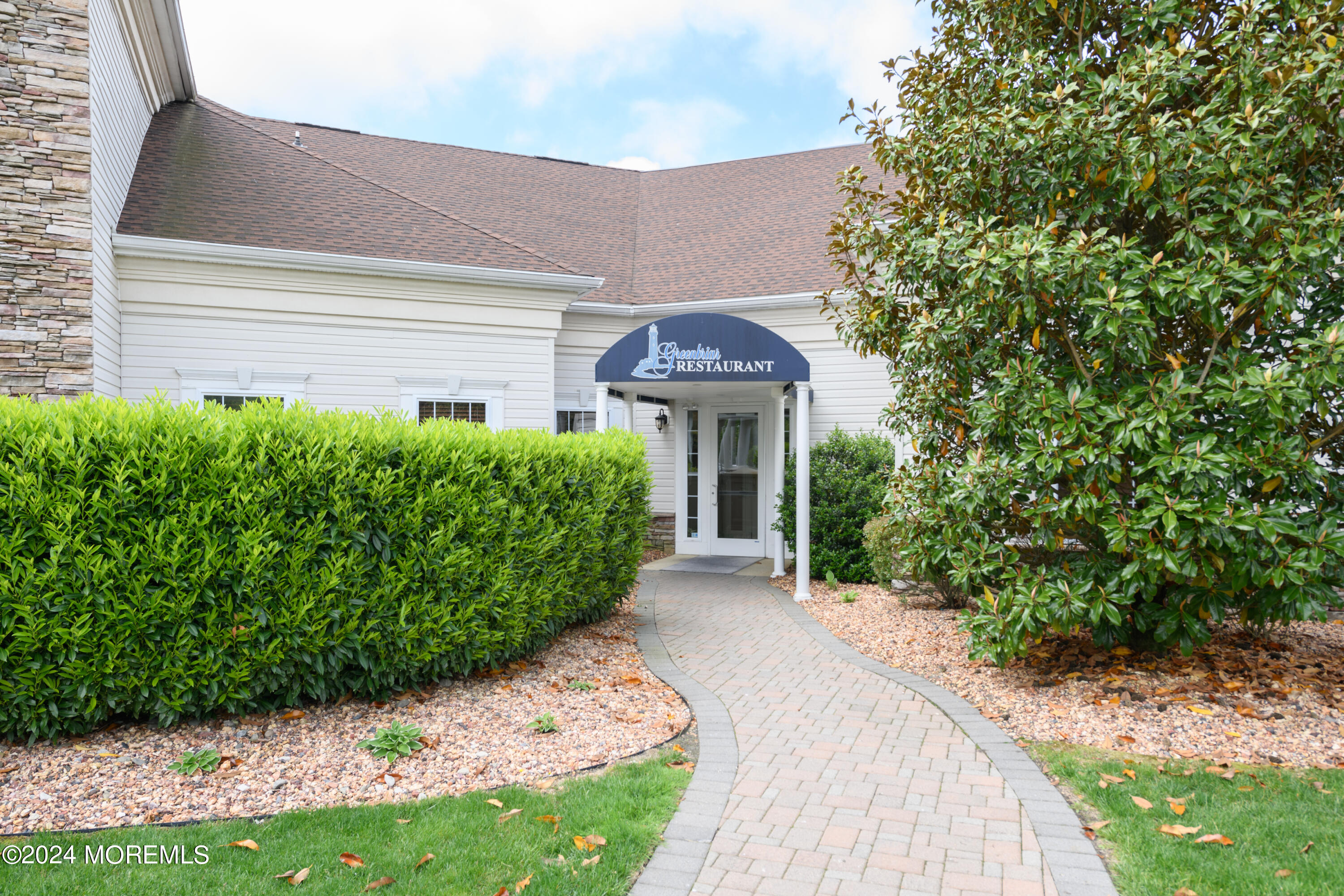 23 Sea Bright Way Waretown, NJ 08758 - Photo 52 of 59 a front view of a house with a yard and potted plants