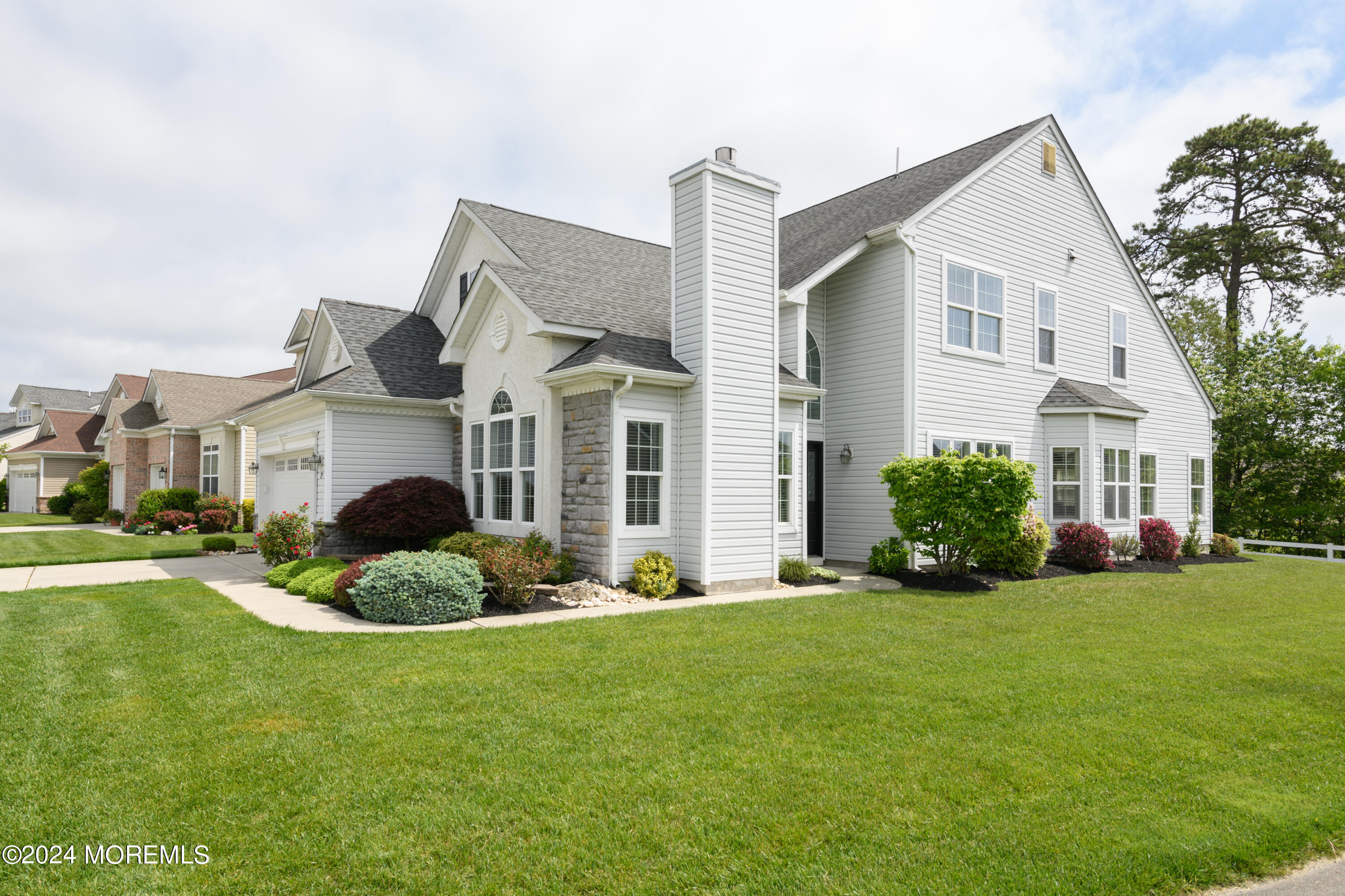 23 Sea Bright Way Waretown, NJ 08758 - Photo 6 of 59 a front view of a house with a yard
