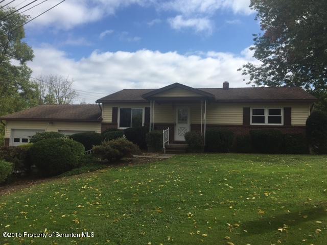 154 Tinklepaugh Road Meshoppen, PA 18630 - Photo 1 of 11 a view of a house with backyard sitting area and garden