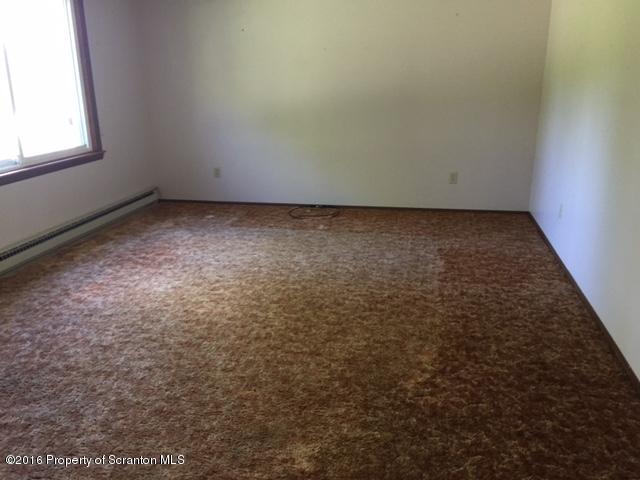 154 Tinklepaugh Road Meshoppen, PA 18630 - Photo 5 of 11 an empty room with a window