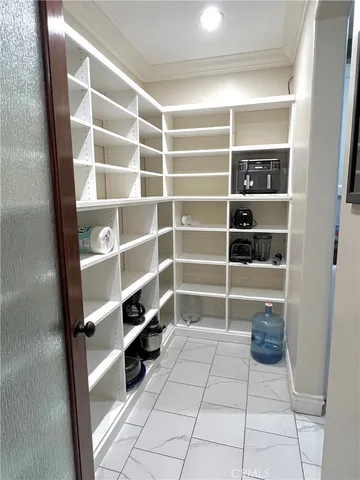 a room with storage and a window