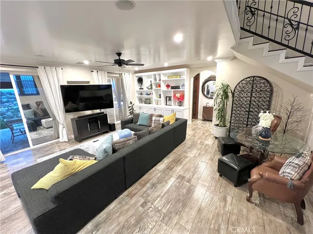 a living room with fireplace furniture and a flat screen tv
