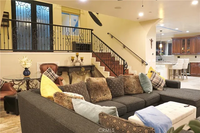 a living room with furniture and a painting