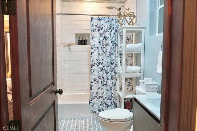 a bedroom with a bed and chair