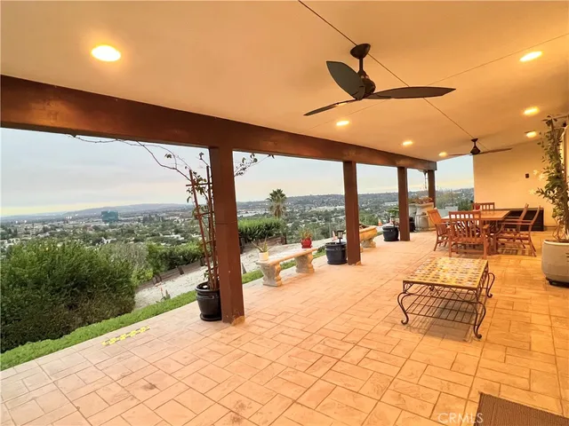 a view of a swimming pool and outdoor seating